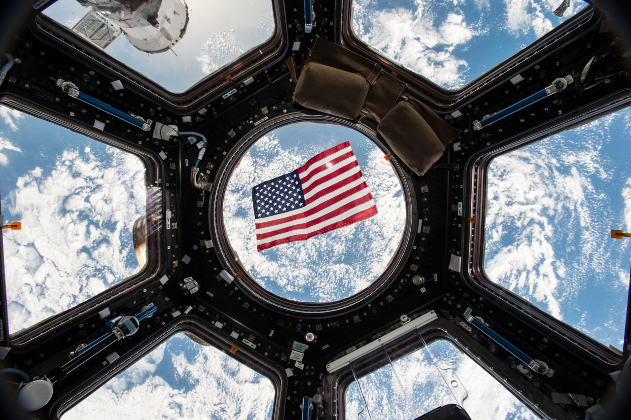 An American flag floats in weightlessness, with the Earth as a magnificent backdrop, in this photo from the Cupola observation room on the International Space Station taken by NASA astronaut Kjell Lindgren.