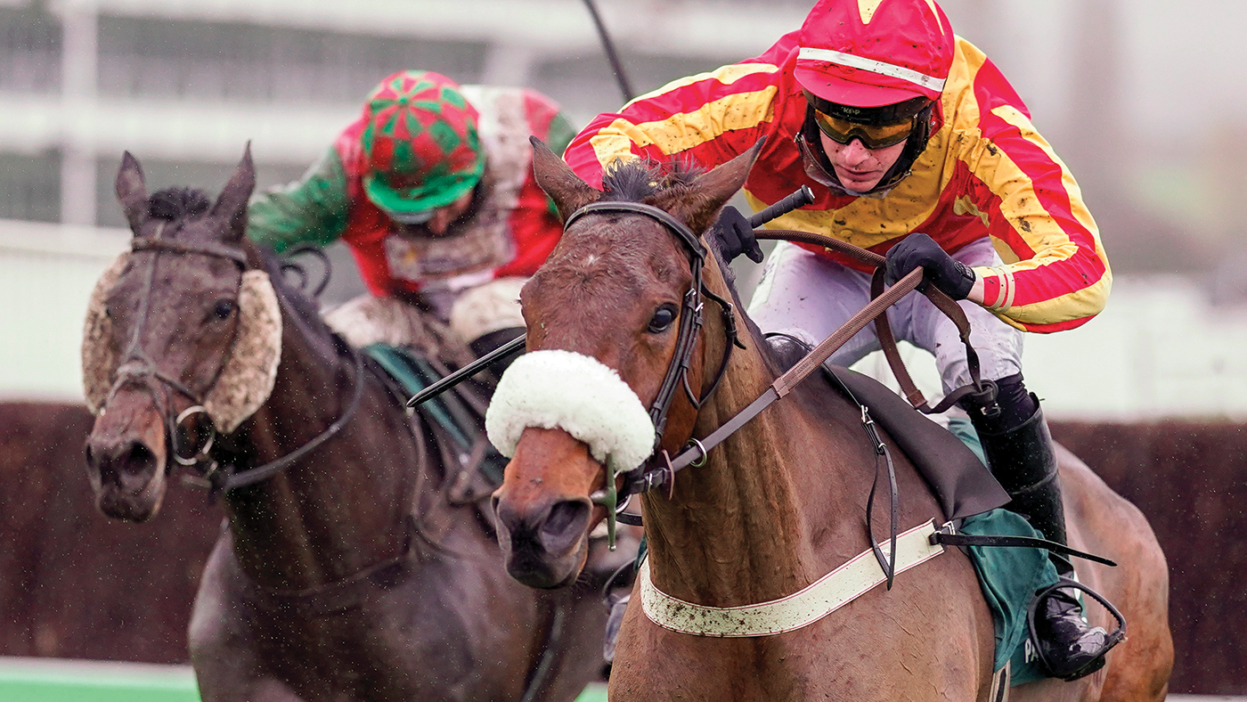 CHELTENHAM, ENGLAND - NOVEMBER 14: Tom O'Brien riding Coole Cody (red/yellow) clear the last to win The Paddy Power Gold Cup Handicap Chase at Cheltenham Racecourse on November 14, 2020 in Cheltenham, England. Owners are allowed to attend if they have a runner at the meeting otherwise racing remains behind closed doors to the public due to the Coronavirus pandemic. (Photo by Alan Crowhurst/Getty Images)