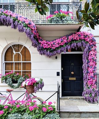 Small front porch idea with pink flowers and wysteria using bike