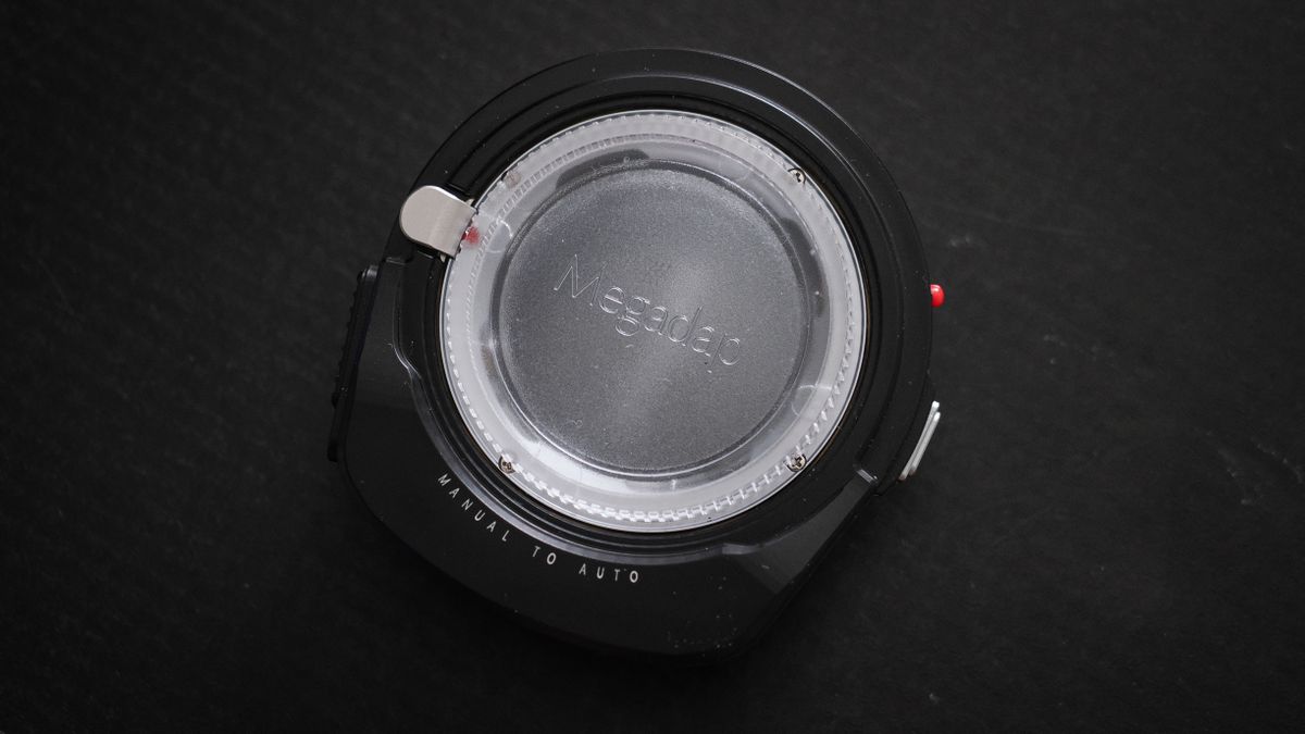 Megadap M2RF adapter on a black surface