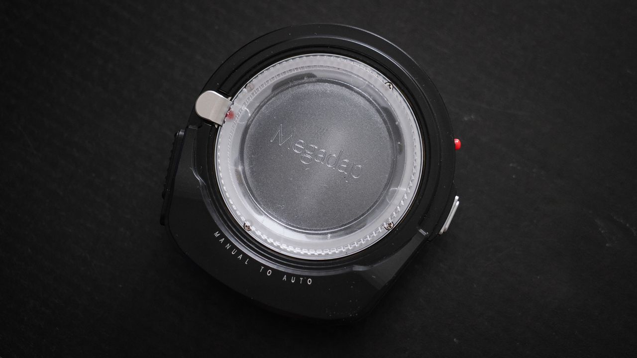 Megadap M2RF adapter on a black surface