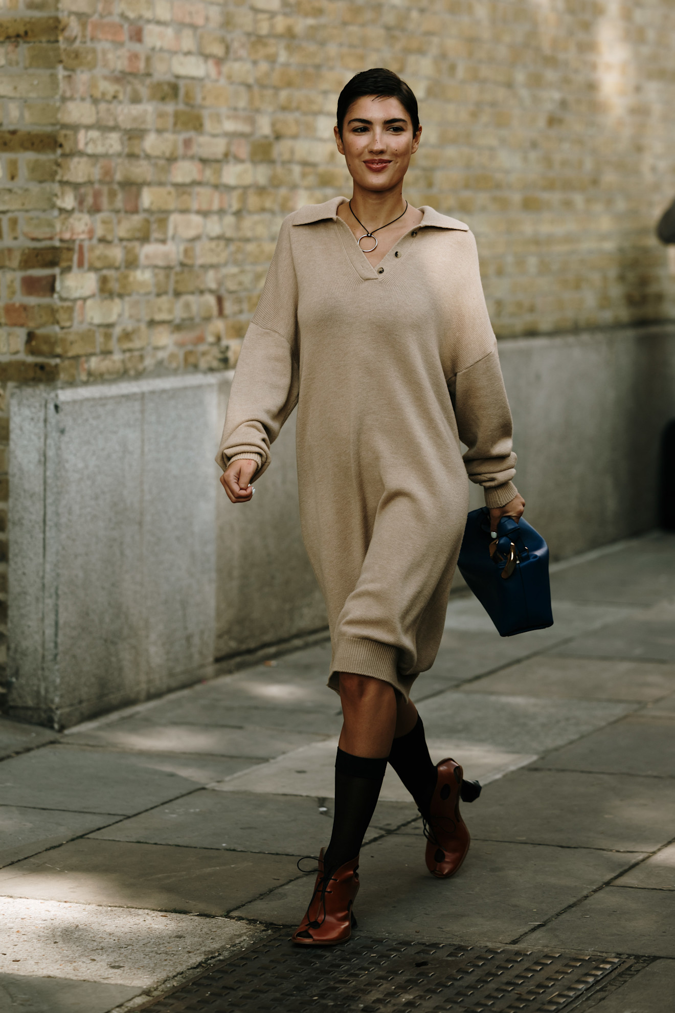 woman wearing beige sweater dress