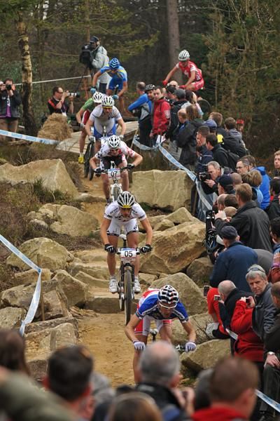 Julien Absalon leads eventual winner Nino Schurter down the technical rock garden.