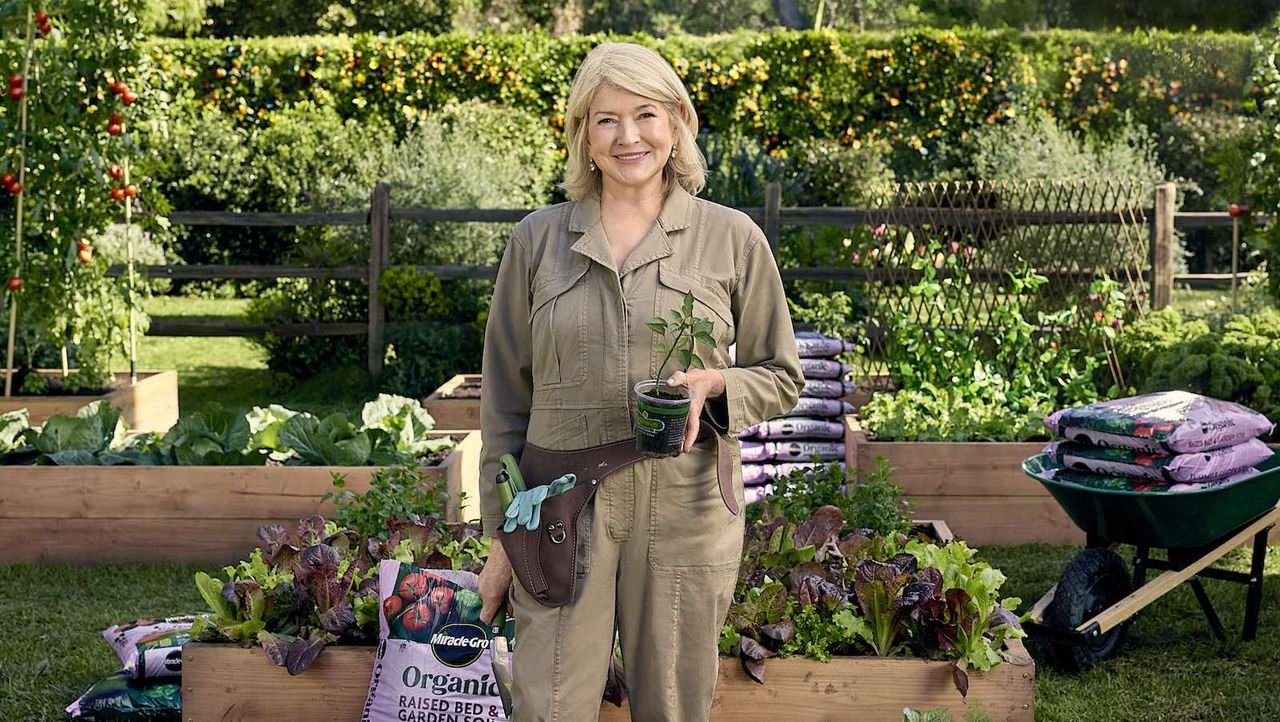 Martha Stewart in a garden of raised beds with vegetables with Miracle-Gro&#039;s new soil