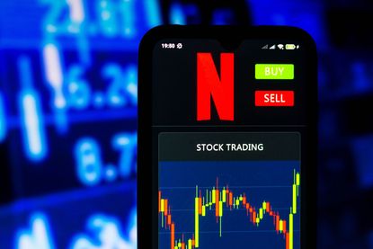 illustration the stock trading graph of Netflix seen on a smartphone screen.