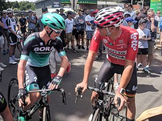Jay McCarthy catches up with Adam Hansen at the start of the race