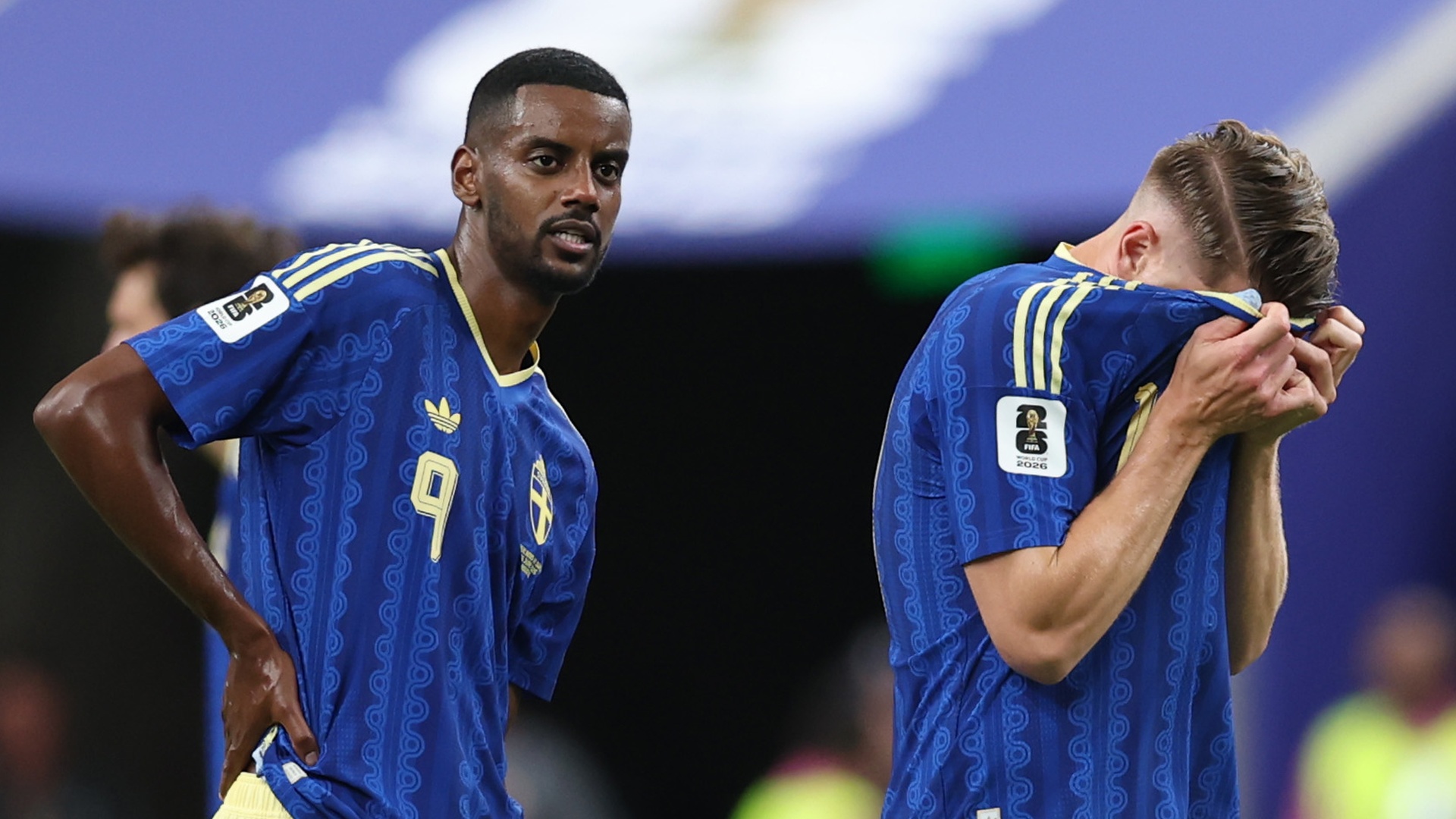 Sweden's Alexander Isak stands with his hands on his hips as Viktor Gyokeres buries his face in his shirt at World Cup 2026