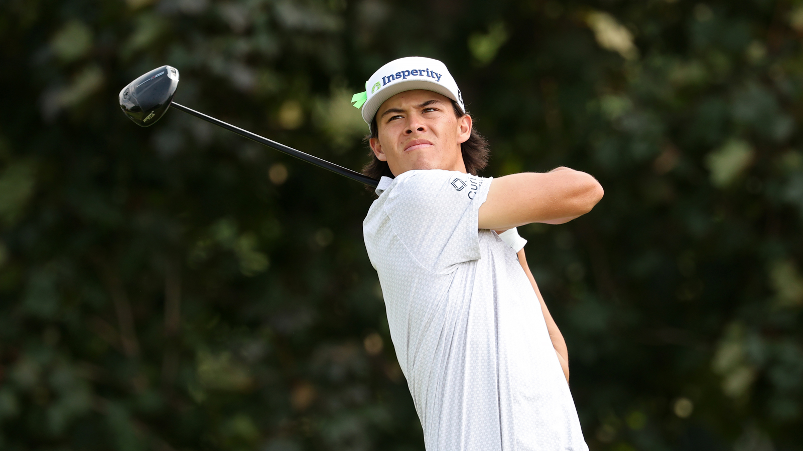 Johnny Keefer hits a driver off the tee