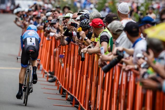 Tom Danielson (Garmin-Sharp) makes it inside the barriers on the way to the finish line.