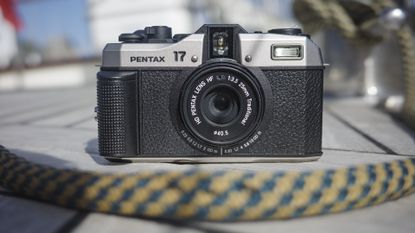 Pentax 17 compact film camera on a sailing boat deck