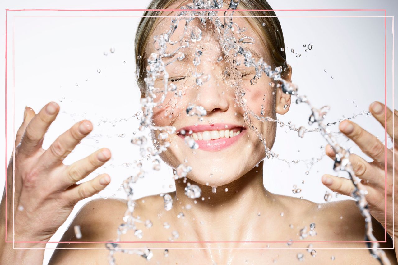 woman demonstrating how to use facial cleanser