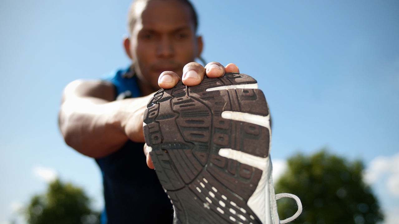 Man stretching after a run