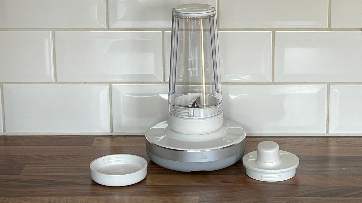 The Millo Smart Portable Blender on a kitchen countertop with its accessories