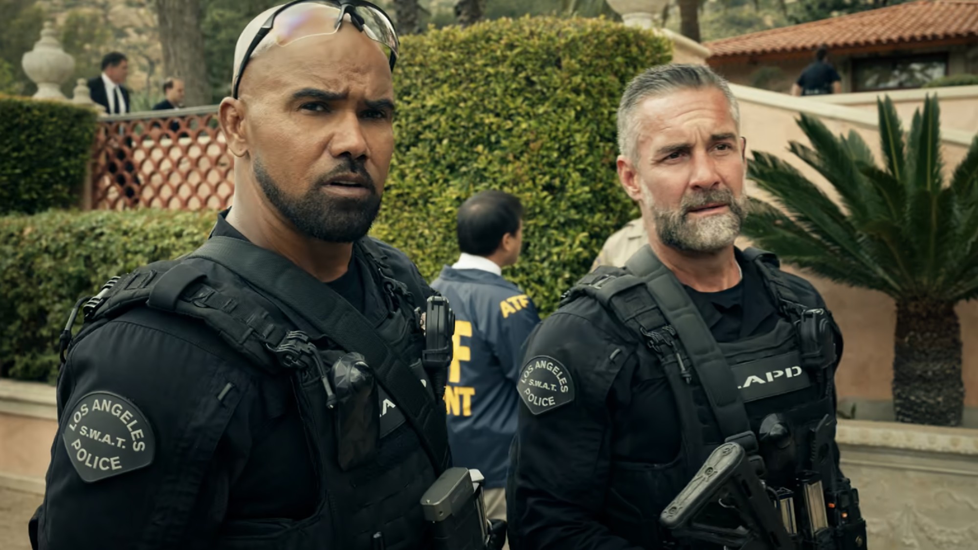 Hondo and Deacon in their uniforms standing next to each other on S.W.A.T.