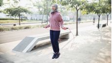 woman jumping rope outdoors