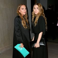 An image of the Olsen twins wearing wide-leg trousers.