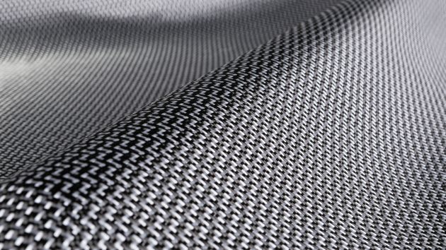 Dyneema is a very strong plastic fabric. Dyneema carbon is a composite that the maker, DSM, claims to be more impact resistant than normal carbon