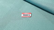 Coloured Byborre fabric with name label on it which says 'Hello my name is Yannick'