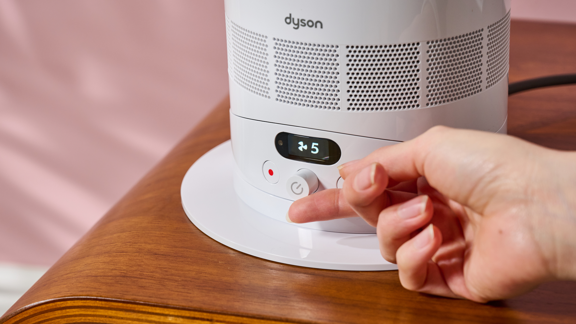 Someone is using the dial to increase the fan speed of the Dyson Hot and Cool HF1.