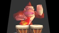 A screenshot of Donkey Kong 64 via DK64 Rekongpiled. Donkey Kong stands in a spotlight while playing his bongos.