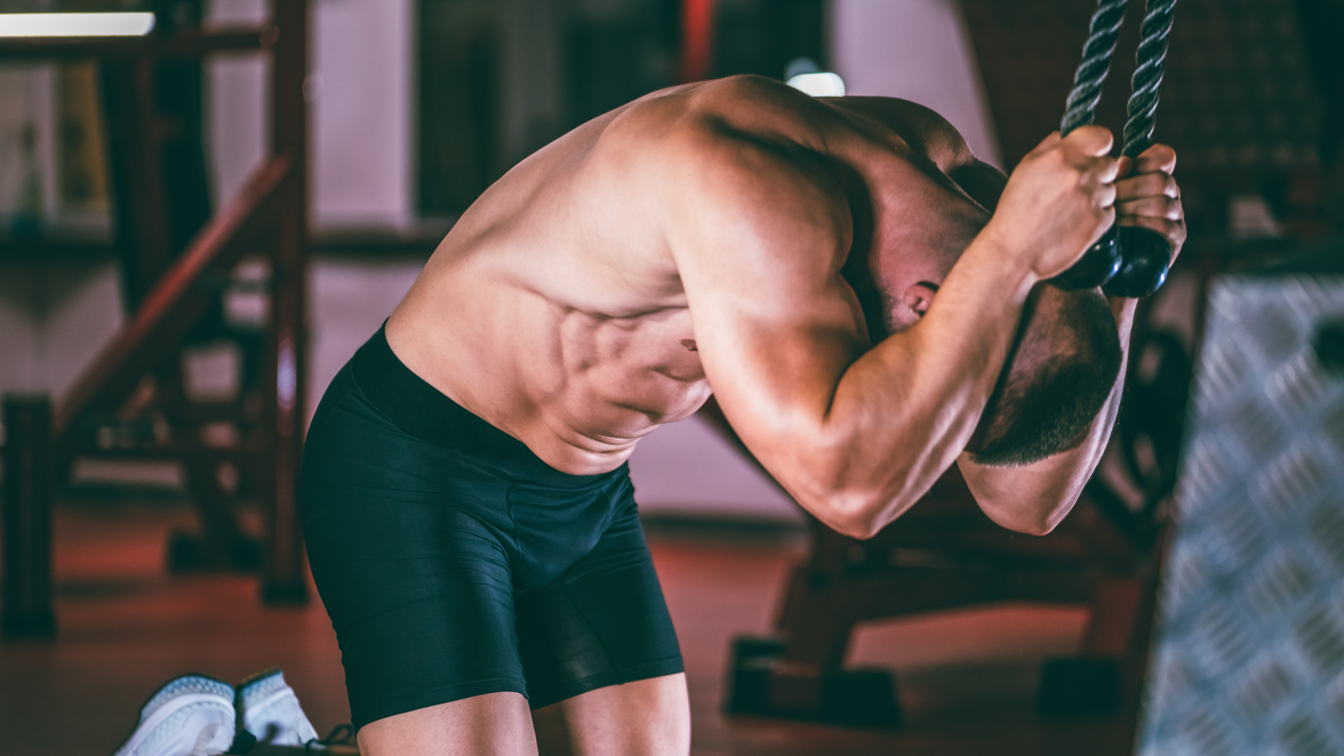 A man performing cable crunches