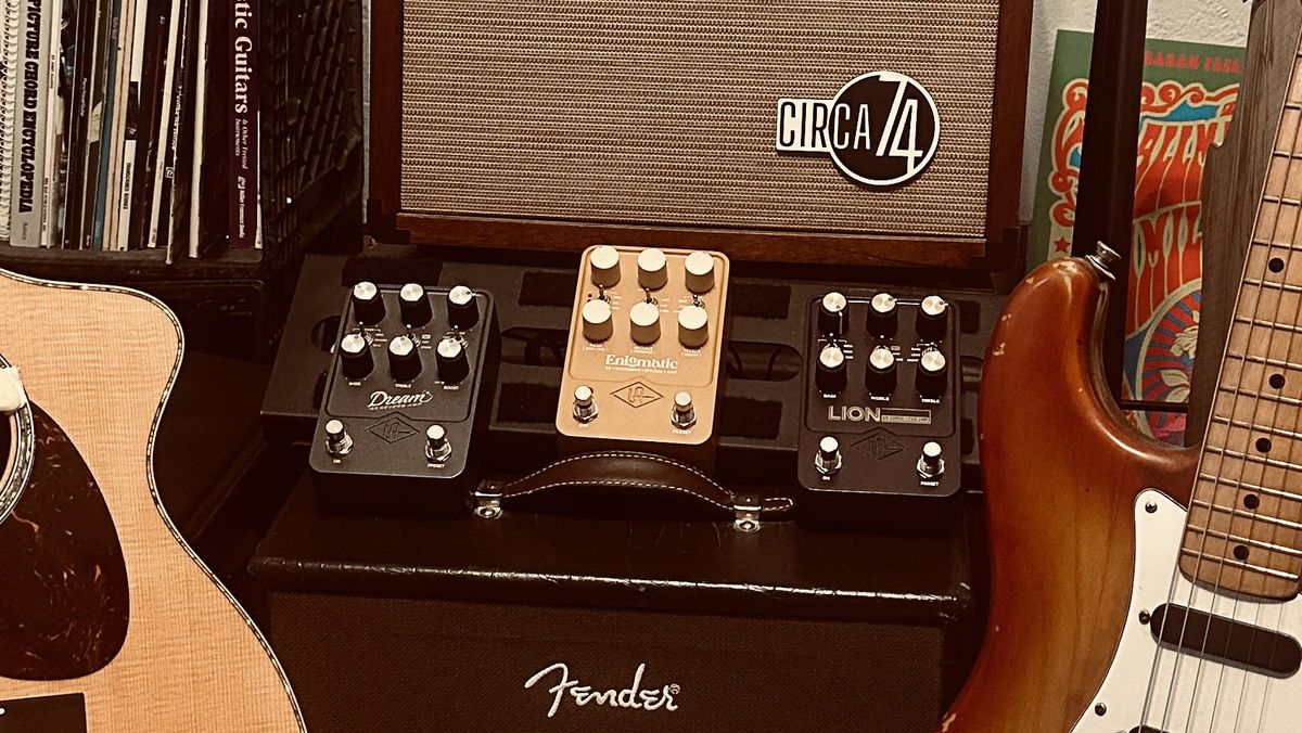 A trio of UAFX amp emulation pedals sit between an acoustic guitar and a Fender Stratocaster in the home studio of contributing writer Jimmy Leslie