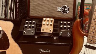 A trio of UAFX amp emulation pedals sit between an acoustic guitar and a Fender Stratocaster in the home studio of contributing writer Jimmy Leslie