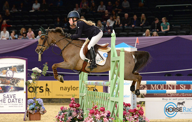 Sienna Charles riding MURKA'S FLINOR SONGBIRD for Peter Charles in the 128cm Class No. 7 at the Horse of the Year Show at the N. E. C. Birmingham, UK between 8th -12th October 2014
