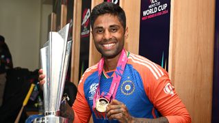 Suryakumar Yadav of India poses with the ICC Men's T20 Cricket World Cup Trophy in the changing rooms following the ICC Men's T20 Cricket World Cup West Indies & USA 2024 Final match between South Africa and India at Kensington Oval on June 29, 2024 in Bridgetown, Barbados.