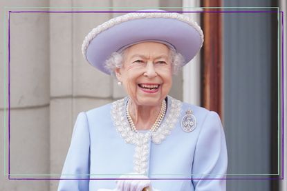  Queen Elizabeth II watches from the balcony of Buckingham Palace during the Trooping the Colour parade the Trooping the Colour parade on June 2, 2022 in London, England. 