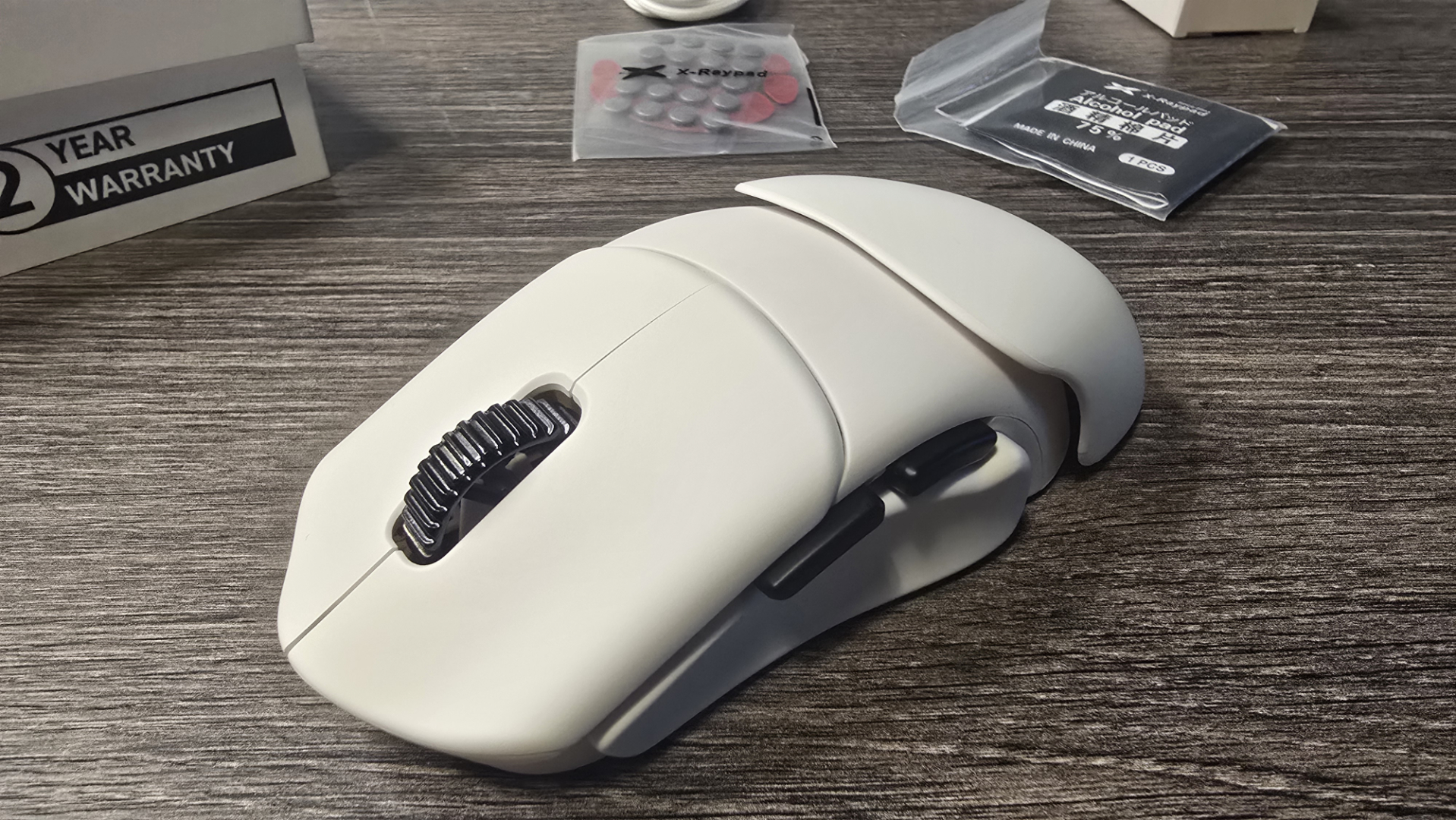 Orbital Pathfinder gaming mouse with various attachments.