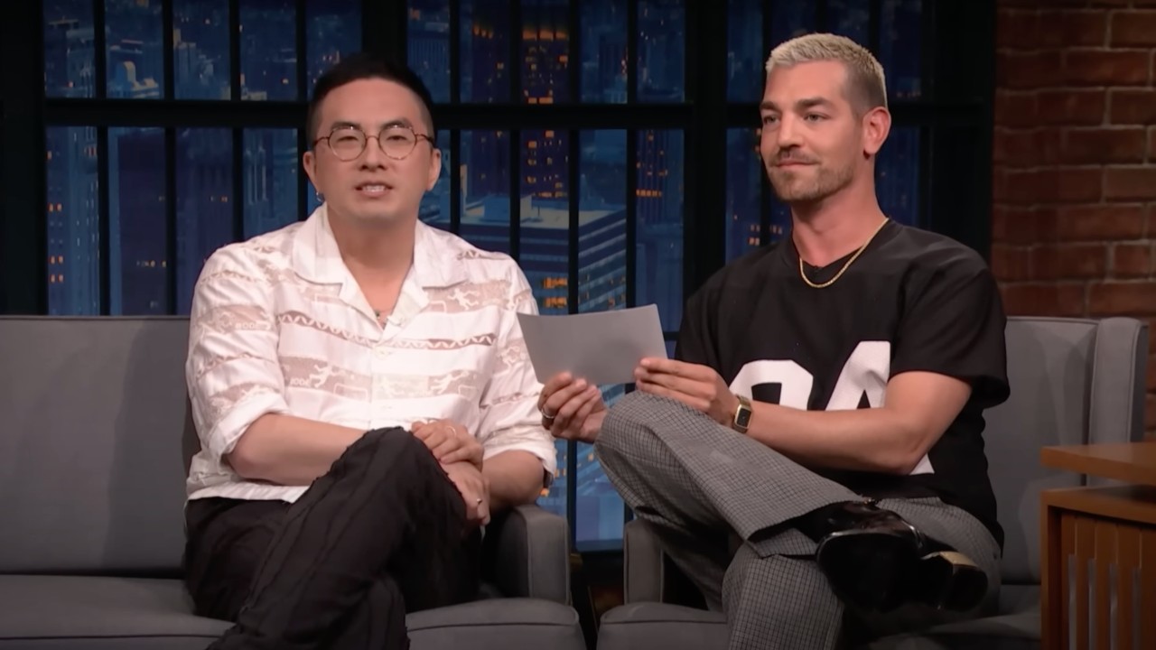 Las Culturistas co-hosts, Matt Rogers and Bowen Yang announcing an early award for their award show.