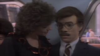 Eddie Murphy disguised as a white man with a woman next to him on SNL