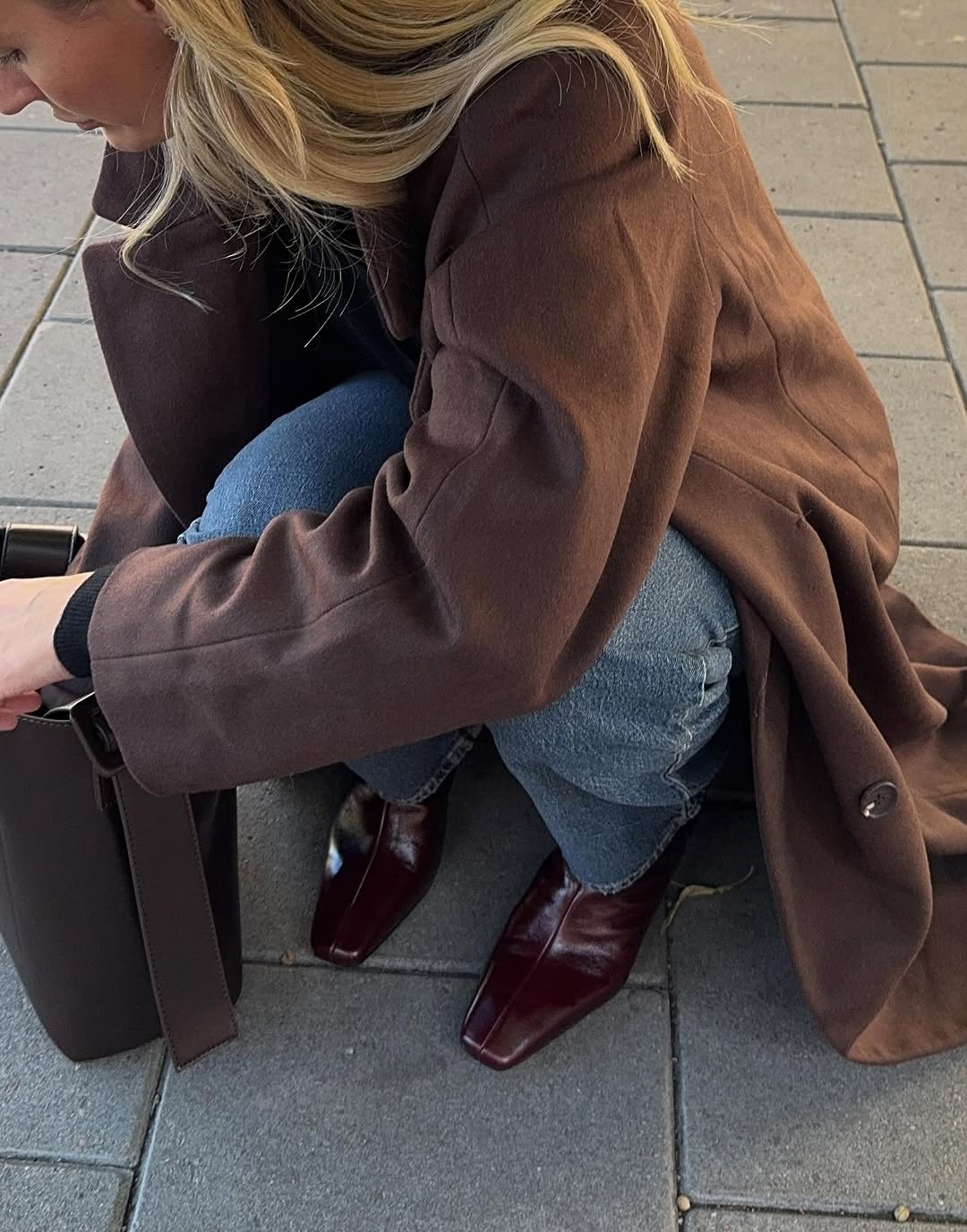 woman wearing brown maroon color trend fall 2025