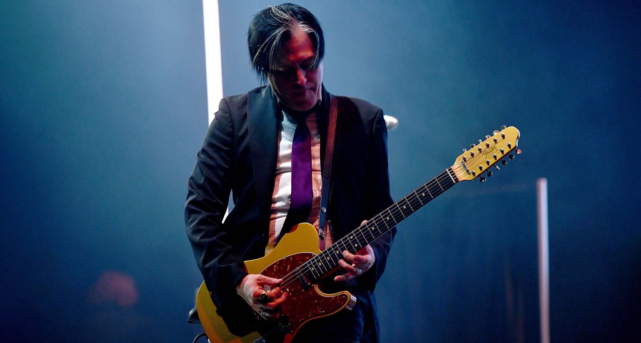 Troy Van Leeuwen plays his Masterbuilt Custom Shop Telecaster XII onstage with Queens Of The Stone Age