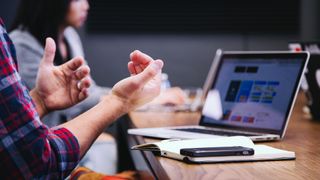 man in meeting on laptop