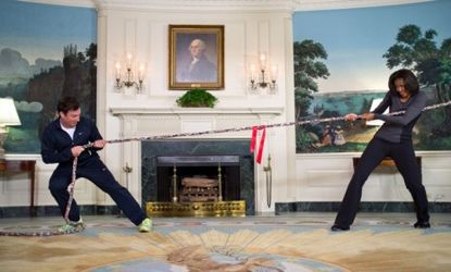 Michelle Obama plays tug-o-war against Jimmy Fallon: The First Lady also had a push-up contest with Ellen DeGeneres and fed veggies to Jay Leno.
