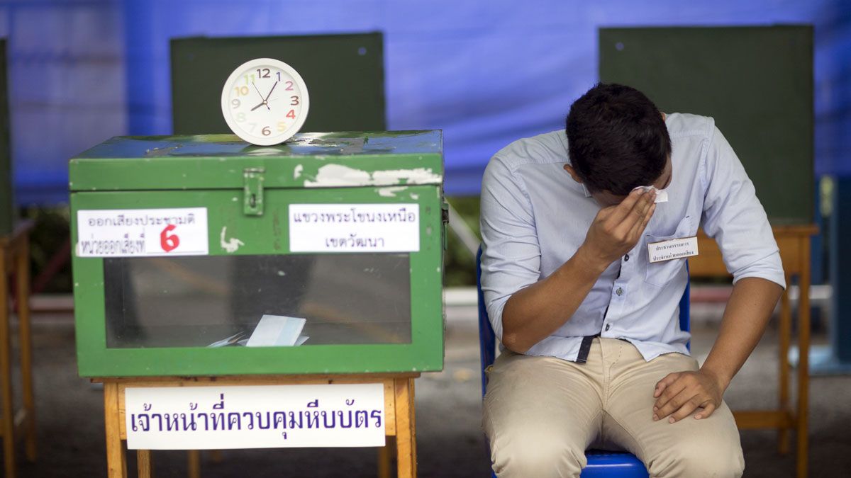 A volunteer supervises a polling station in Bangkok last weekend. Voters supported a new, military-backed constitution