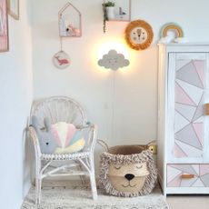 kids room with white wall and chair and wardrobe