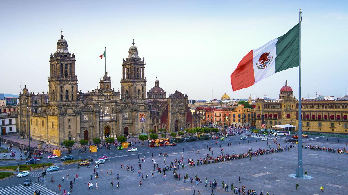 The Mexican flag flies over the Zocalo, the main square in Mexico City