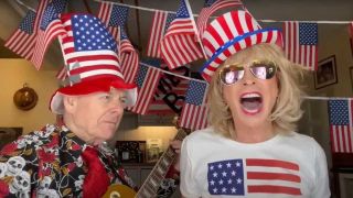 Robert Fripp and Toyah Willcox in their kitchen, which is bedecked with American flags