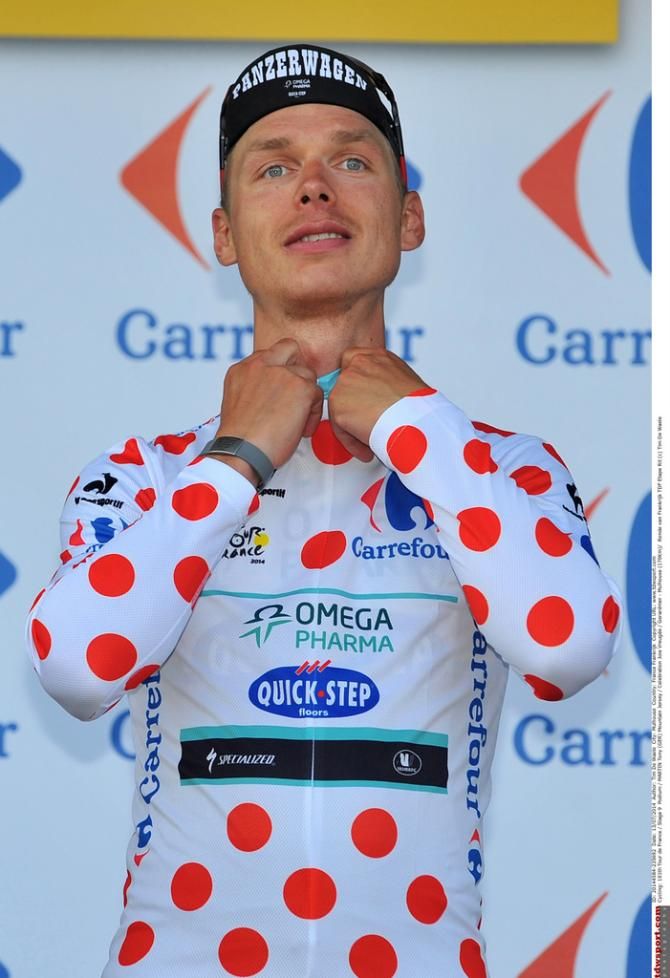 Tony Martin adjustes his polka dot jersey
