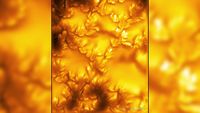 Yellow and orange swirls show the sun in sharp detail. 