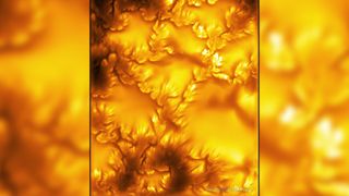 Yellow and orange swirls show the sun in sharp detail. 