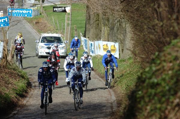 The Francaise des Jeux team tests out a variety of lines across the cobbles.