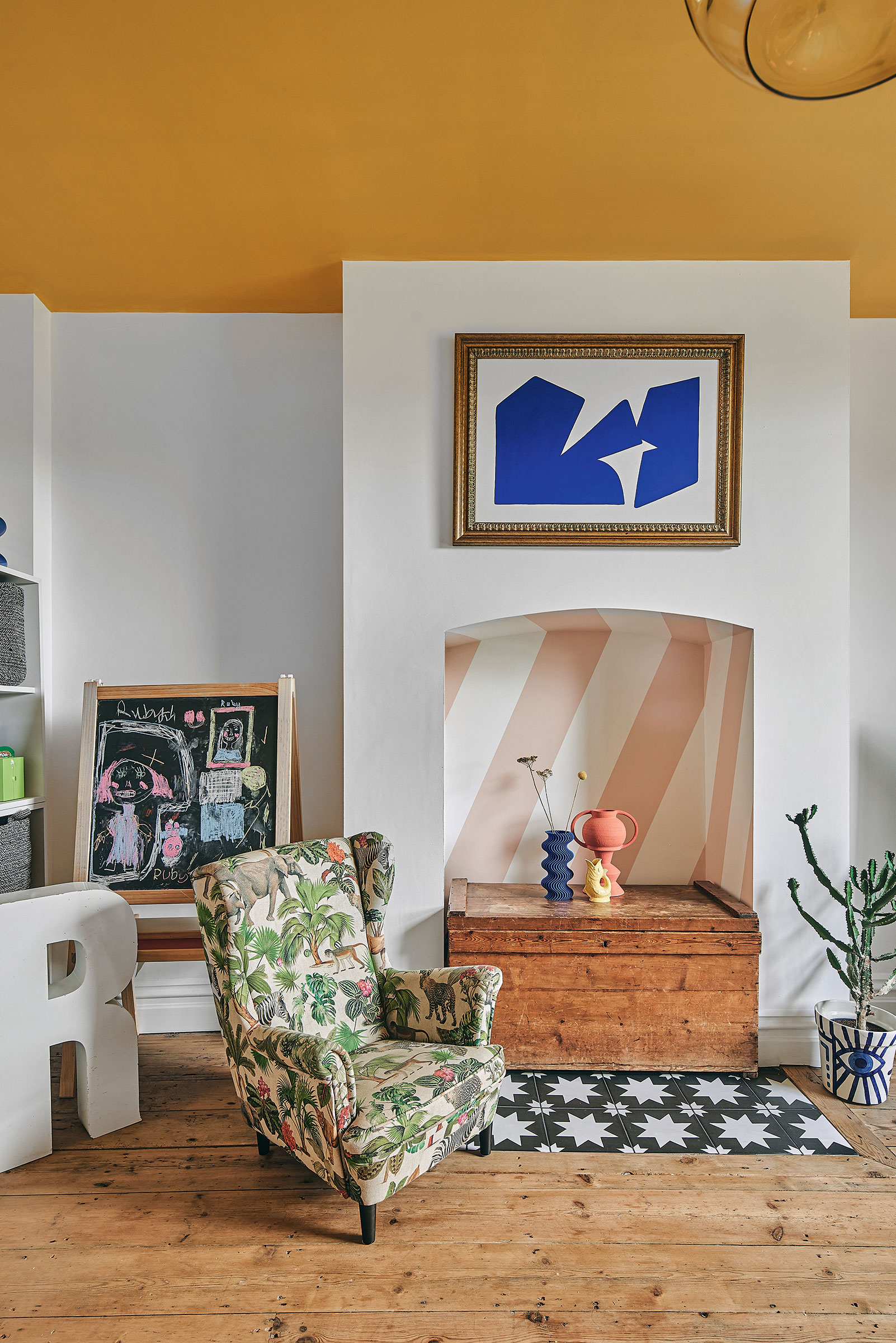 empty fireplace with painted stripes