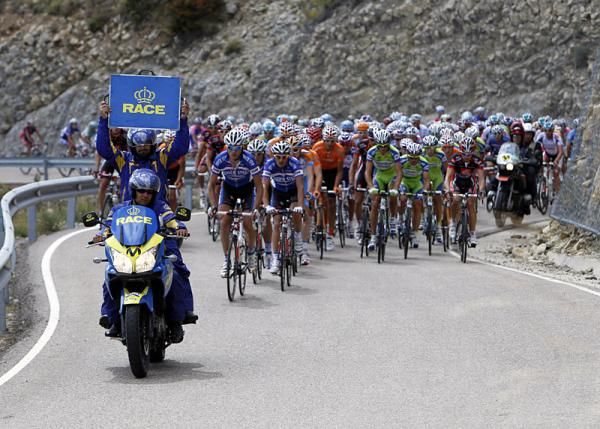 The peloton climbs during stage 12.