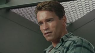 Arnold Scharzenegger stands over his ex-wife in Total Recall