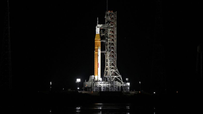 A photo of the Artemis II SLS rocket and Orion spacecraft on a launch pad at the Kennedy Space Center in Cape Canaveral, Florida, at night. 