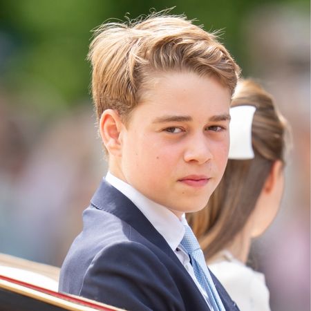 Prince George riding in a carriage with Princess Charlotte